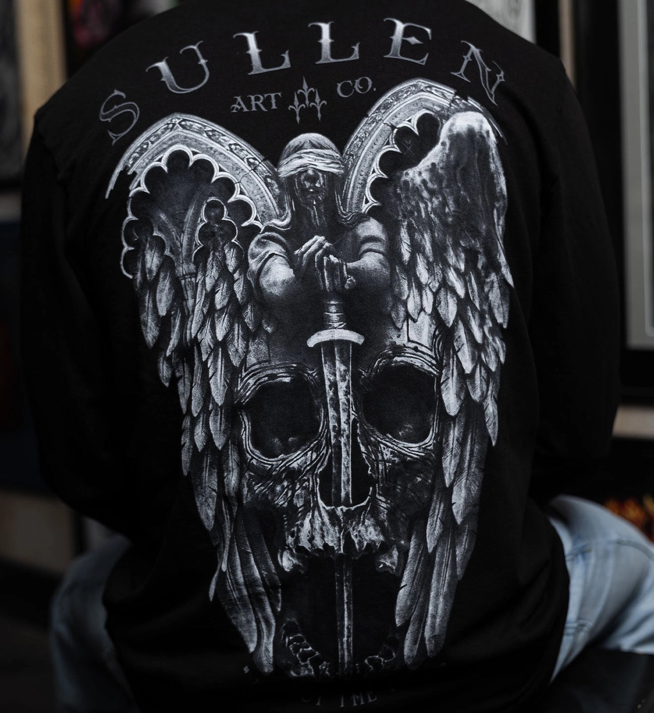SULLEN CLOTHING WINGED JUSTICE FRENCH TERRY LONG SLEEVE TOP