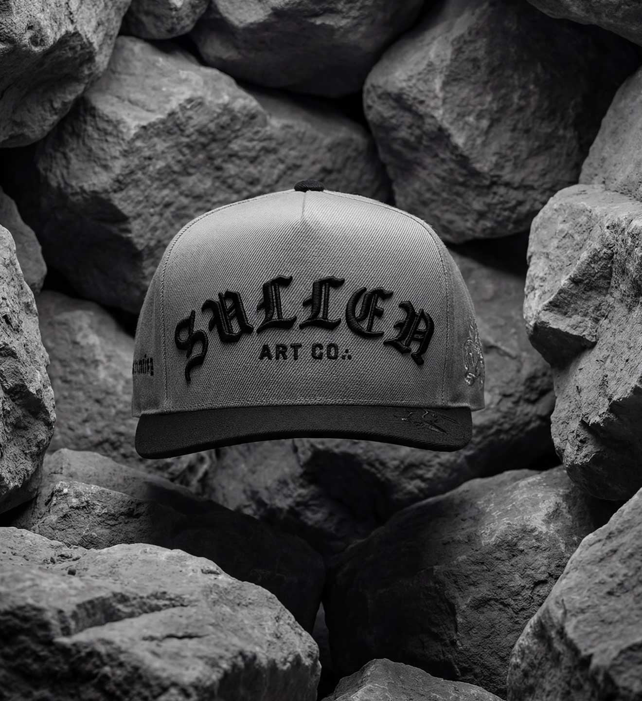 SULLEN CLOTHING ROCK SCRIPT DARK CHARCOAL SNAPBACK CAP